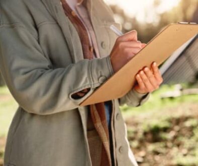 Writing, checklist and hands of person on (1)